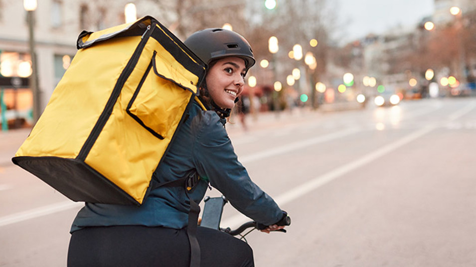  A young delivery cyclist on their way on the route.