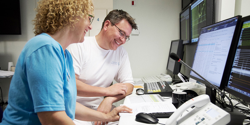 Two colleagues planning the working schedule for their team